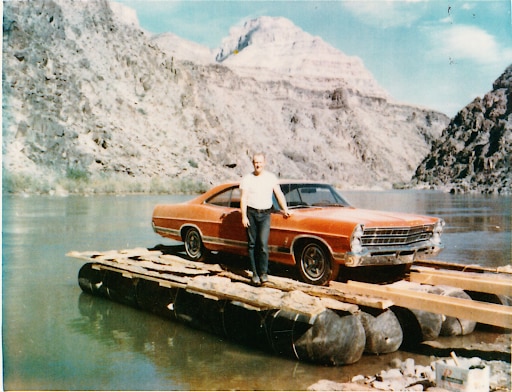Ted Hatch standing next to the raft-ready 1967 Ford LTD.